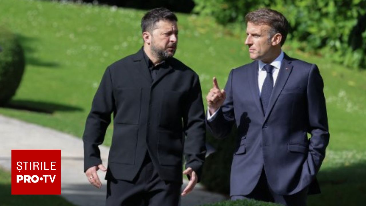 Emmanuel Macron și Volodimir Zelenski discutând la summitul G7.